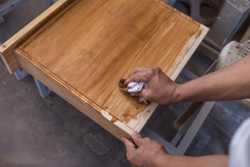 Applying stain to teak